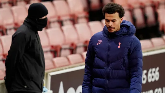 Dele Alli of Tottenham walks to the dressing room following his substitution during the Carabao Cup match at The Bet365 Stadium, Stoke