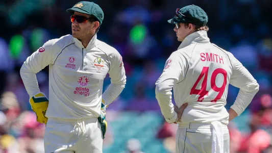 Australian captain Tim Paine, left, talks with teammate Steve Smith during play on day three of the third cricket test between India and Australia at the Sydney Cricket Ground