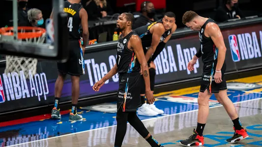 Brooklyn Nets forwards Kevin Durant (7) and Blake Griffin (2) walk off the court during the second half of the team's NBA basketball game against the Los Angeles Lakers