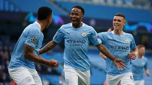 Manchester City's Raheem Sterling, center, celebrates after scoring the opening goal during the Champions League round of 16, second leg soccer match between Manchester City and Real Madrid at the Etihad Stadium in Manchester