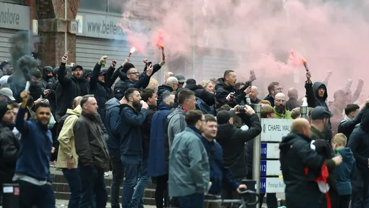 Manchester United fans protest outside the Lowry Hotel where team was staying during a protest against the Glazer family, owners of Manchester United, before their Premier League match against Liverpool at Old Trafford