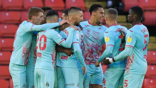 Andre Ayew #10 of Swansea City celebrates his goal with team-mates