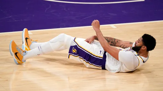 Los Angeles Lakers forward Anthony Davis takes a fall during the second half in Game 4 of an NBA basketball first-round playoff series against the Phoenix Suns