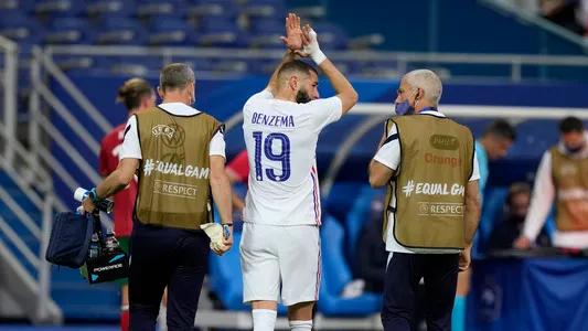 France's Karim Benzema reacts to the fans as walks out after an injury during the international friendly soccer match between France and Bulgaria at the Stade De France