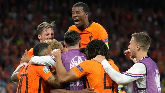 Netherlands players celebrate after Denzel Dumfries of the Netherlands scored his side's third goal during the Euro 2020 soccer championship group C match between the Netherlands and Ukraine at the Johan Cruijff Arena in Amsterdam