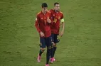 Spain Held in Opener, Schick Scores Stunner