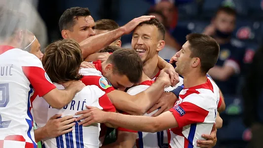 Croatia's Ivan Perisic, 2nd from right, is celebrated after scoring his side's third goal during the Euro 2020 soccer championship group D match between Croatia and Scotland at the Hampden Park