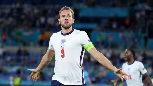 England's Harry Kane celebrates after scoring his side's third goal during the Euro 2020 soccer championship quarterfinal match between Ukraine and England at the Olympic stadium in Rome