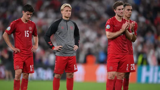 Denmark players applaud fans at the end of the Euro 2020 soccer semifinal match between England and Denmark at Wembley stadium in London