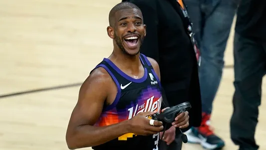 Chris Paul smiles at the crowd after Game 1 of basketball's NBA Finals against the Milwaukee Bucks, Tuesday, July 6, 2021, in Phoenix. The Suns defeated the Bucks 118-105.