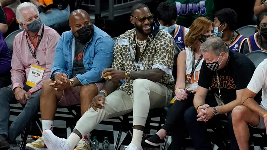 LeBron James smiles during the second half of Game 5 of basketball's NBA Finals between the Phoenix Suns and the Milwaukee Bucks, Saturday, July 17, 2021, in Phoenix