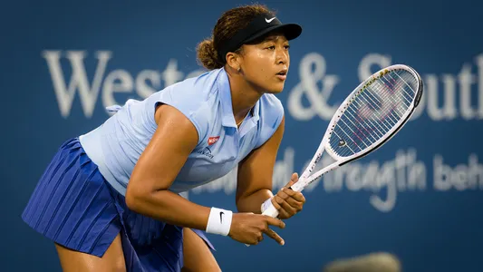 Naomi Osaka of Japan in action during her third round match at the 2021 Western & Southern Open WTA 1000 tennis tournament against Jil Teichmann of Switzerland.