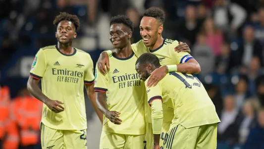 Pierre-Emerick Aubameyang #14 of Arsenal celebrates scoring a goal to make it 0-2 in West Bromwich
