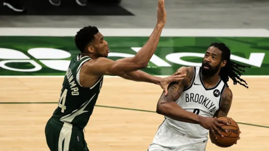 DeAndre Jordanis defended by Giannis Antetokounmpo Milwaukee Bucks during the first half of a game at Fiserv Forum on May 02, 2021 in Milwaukee, Wisconsin.