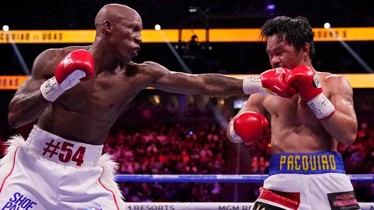 Yordenis Ugas hits Manny Pacquiao in a welterweight championship boxing match Saturday, Aug. 21, 2021, in Las Vegas.