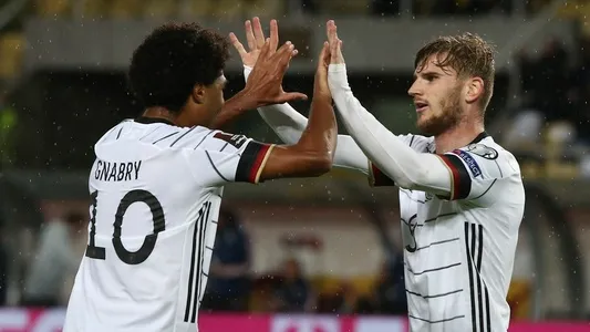 Germany's Timo Werner, right, reacts after scoring his side's second goal during the World Cup 2022 group J qualifying soccer match between North Macedonia and Germany