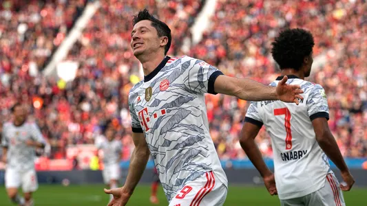 Bayern's Robert Lewandowski celebrates after scoring his side's second goal during the German Bundesliga soccer match between Bayer Leverkusen and Bayern Munich in Leverkusen