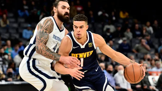 Michael Porter Jr. handles the ball against teven Adams in the first half of an NBA basketball game Monday, Nov. 1, 2021, in Memphis, TN