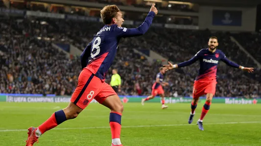 Atletico Madrid's Antoine Griezmann celebrates after scoring the opening goal during the Champions League Group B soccer match between FC Porto and Atletico Madrid