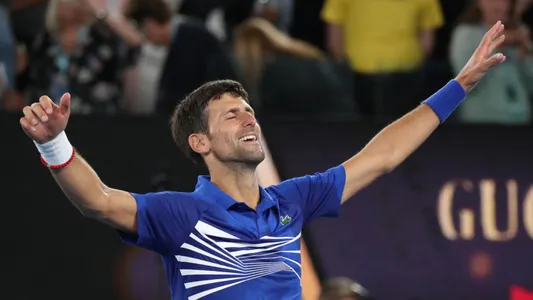 Australian Open champion Novak Djokovic of Serbia celebrates victory after men's final match against Rafael Nadal of Spain at Rod Laver Arena in Melbourne, January 27, 2019 — Photo by zhukovsky