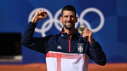 Novak Djokovic celebrates winning his maiden Olympic gold medal by beating Carlos Alcaraz (not pictured) at Paris 2024. Aug. 4, 2024. Paris, France. Photo credit: Credit: Dubreuil/Kopatsch/Zimmer / ITF.