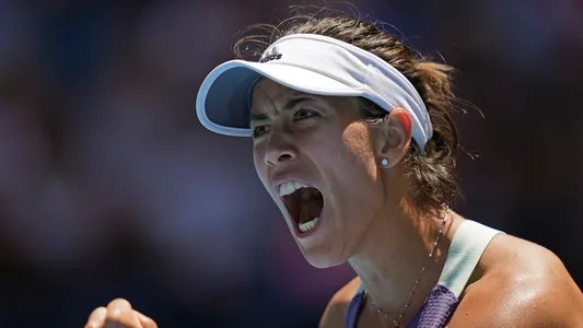 Spain's Garbine Muguruza reacts after winning the first set against Russia's Anastasia Pavlyuchenkova during their quarterfinal match at the Australian Open