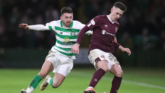 Celtic's Greg Taylor and Hearts' Jamie Walker battle for the ball during the Ladbrokes Scottish Premiership match at Celtic Park