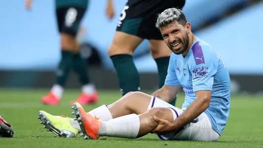 Manchester City's Sergio Aguero reacts as he sits on the pitch injured during the English Premier League soccer match between Manchester City and Burnley at Etihad Stadium
