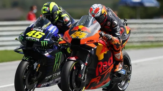 Monster Energy Yamaha's Valentino Rossi and Red Bull KTM Factory Racing's Pol Espargaro in action during the race