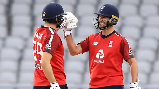 England's Dawid Malan (left) and Lewis Gregory celebrate after the Vitality IT20 match at Old Trafford, Manchester