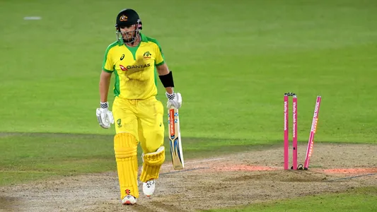 Australia captain Aaron Finch walks off dejected after being bowled out by England's Adil Rashid during the third Vitality IT20 match at the Ageas Bowl