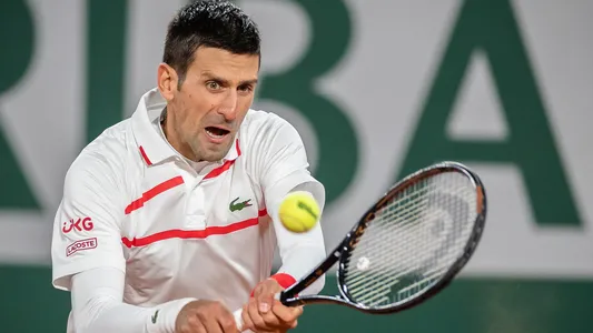 Novak Djokovic of Serbia hits a return during the men's singles third round match against Daniel Galan of Colombia in the French Open