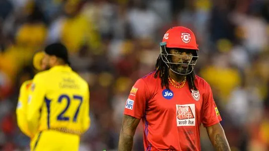 Kings XI Punjab cricketer Chris Gayle walks back towards the pavilion after he was dismissed during the 2019 Indian Premier League (IPL) Twenty20 cricket match between Kings XI Punjab and Chennai Super Kings